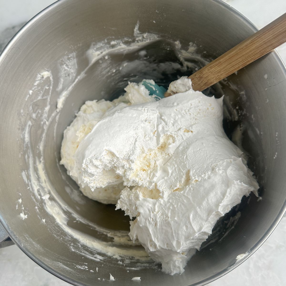 Bowl with Cool Whip and cream cheese. 