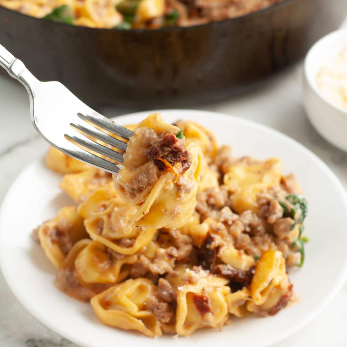 Plate with tortellini and sausage. 