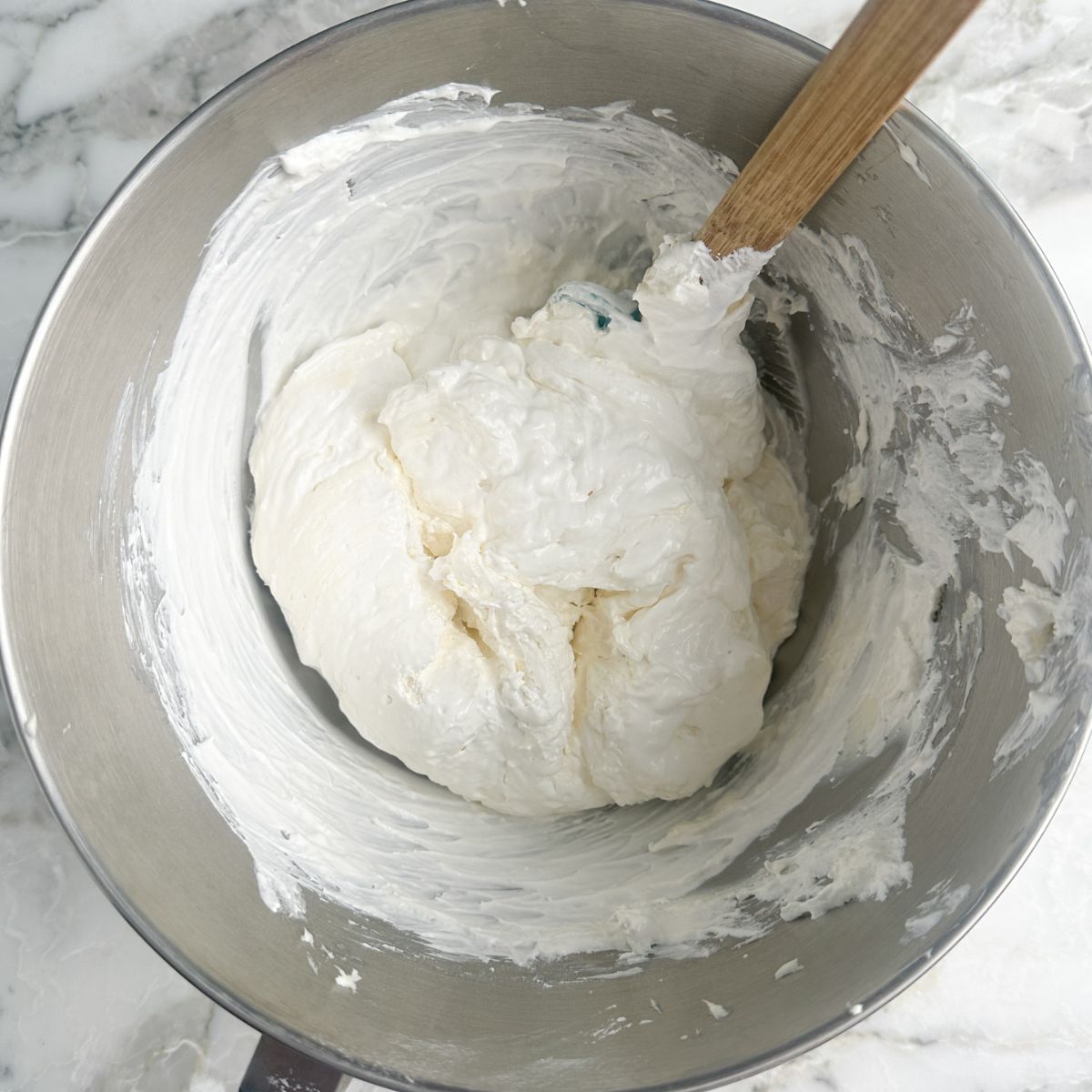 Bowl with creamy dip and spatula. 