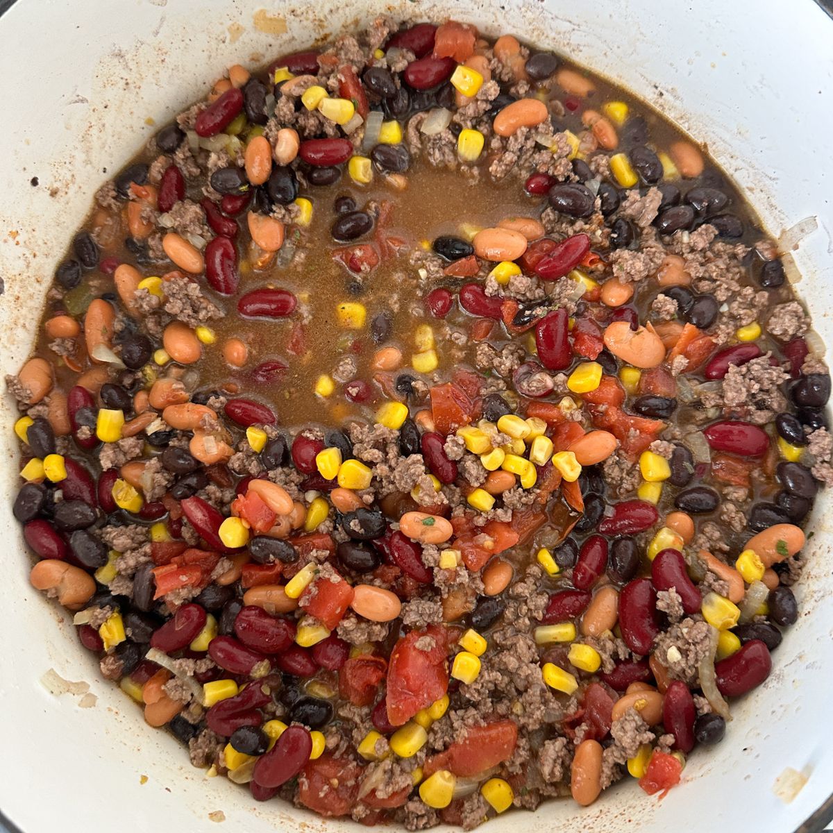 Pot with bean, beef, and corn soup. 