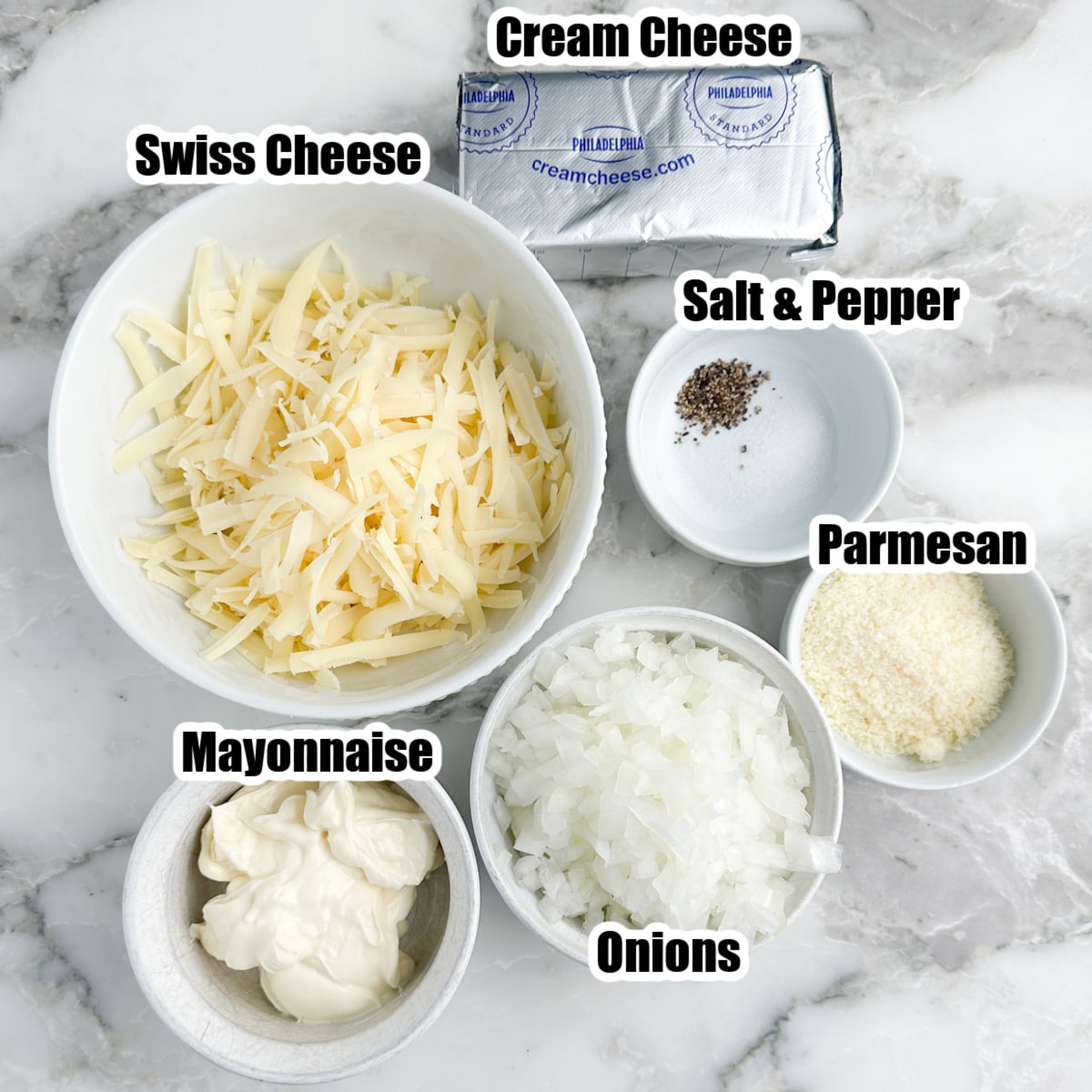 Bowl of onions, cheese, cream cheese, and mayonnaise.