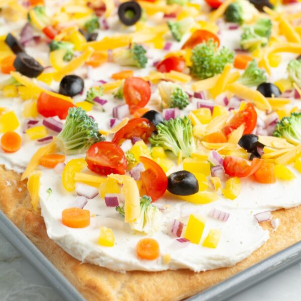 Crescent roll vegetable pizza in a pan.