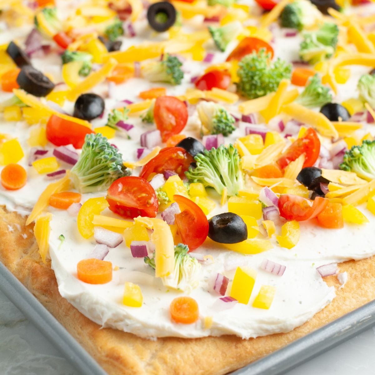 Crescent roll vegetable pizza in a pan. 