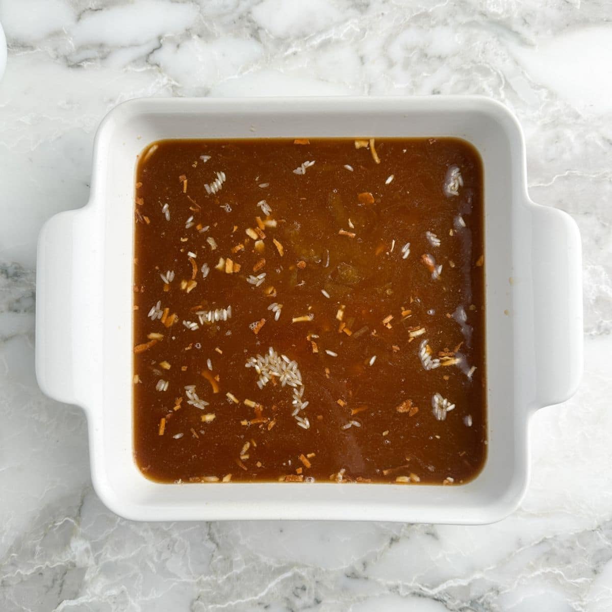 Baking dish with beef broth. 