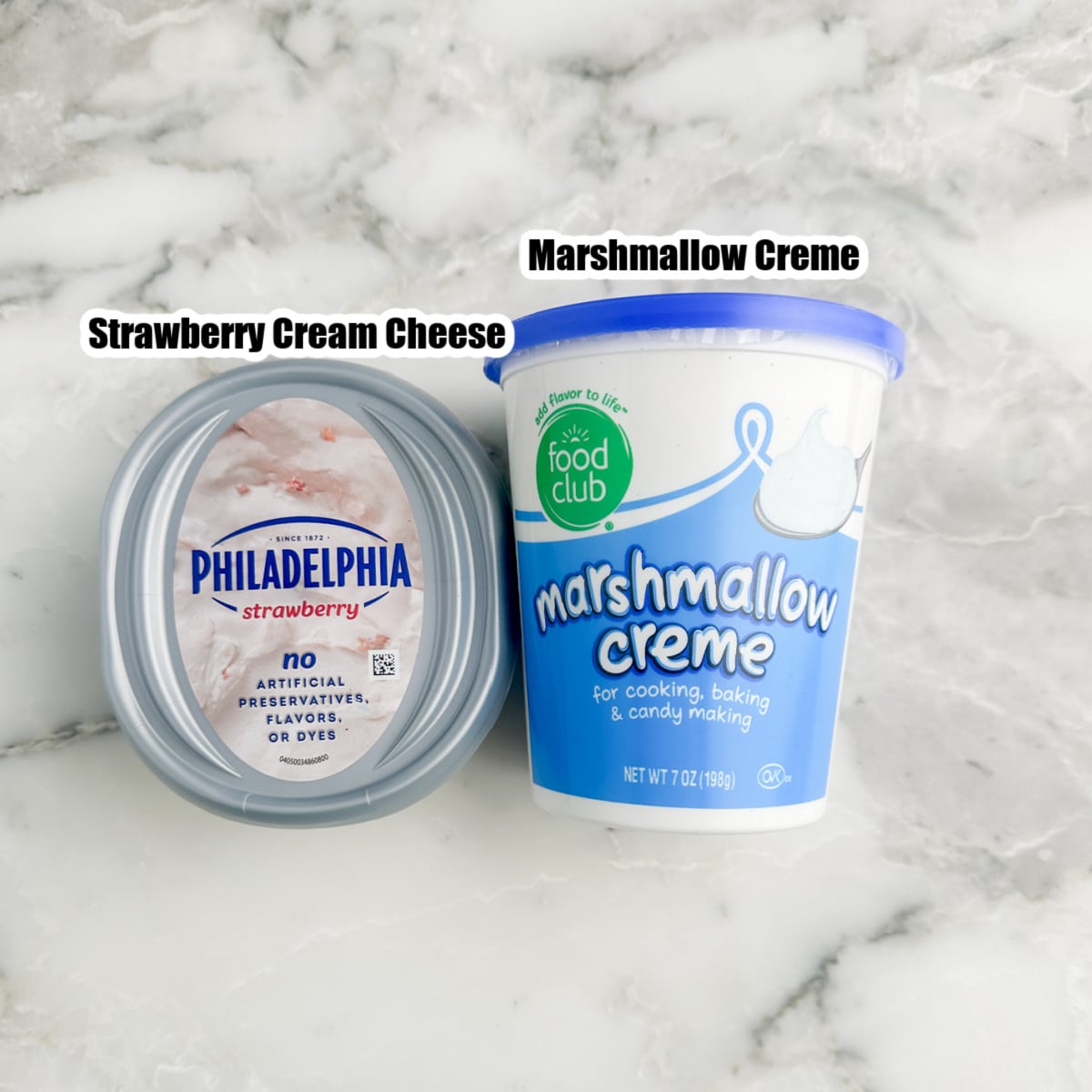 Container of strawberry cream cheese and marshmallow creme. 