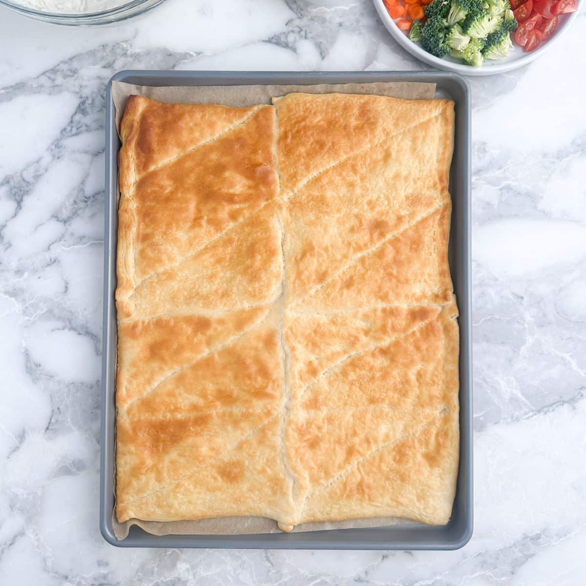 Baked crescent dough on a baking sheet. 