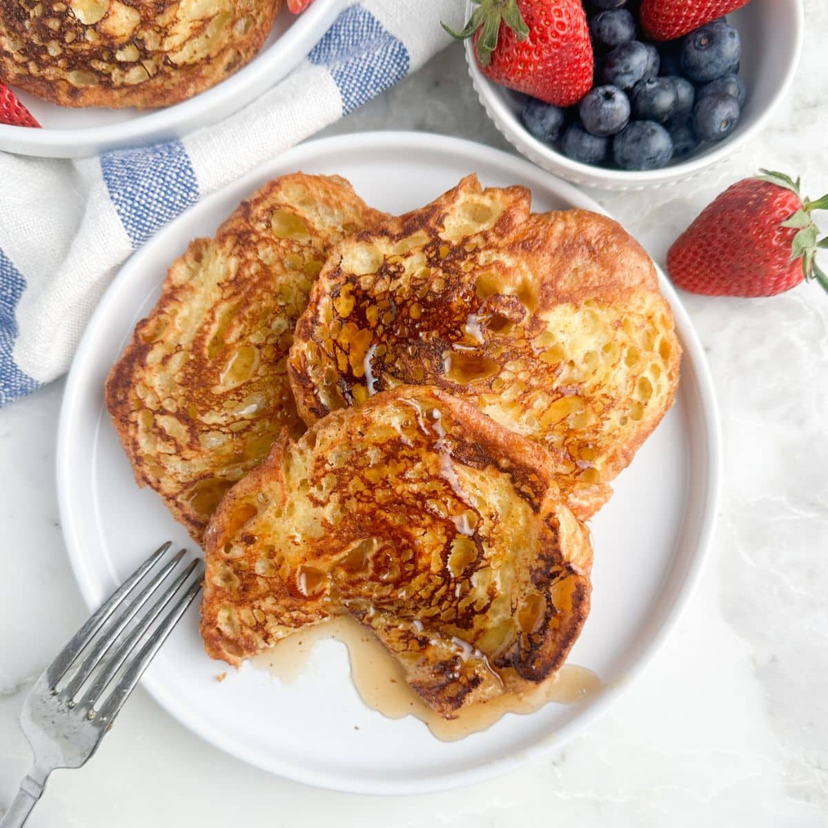 Plate of french toast with syrup.