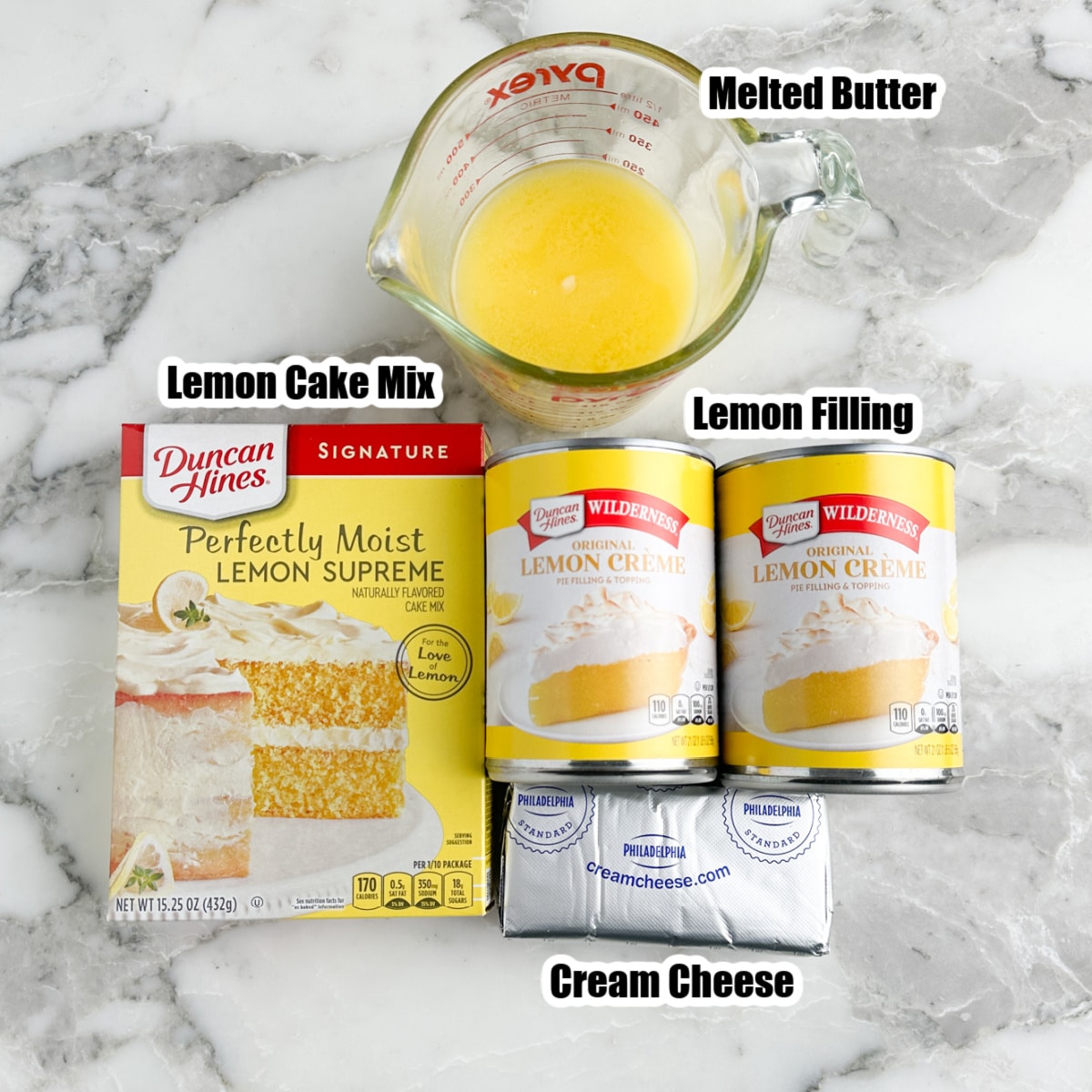 Box of lemon cake mix, melted butter, lemon filling, and cream cheese. 