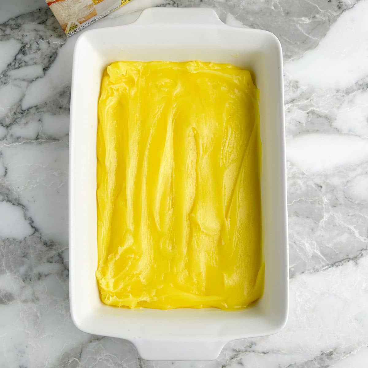 Baking dish with lemon pie filling.